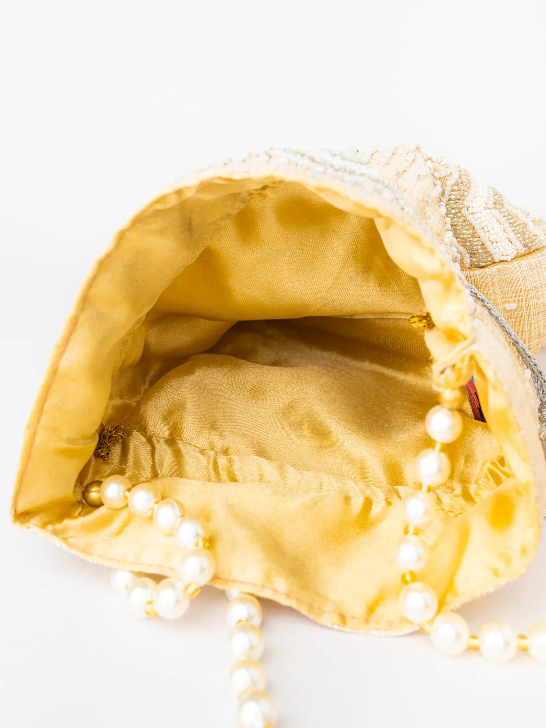 NR By Nidhi Rathi Cream-Coloured Gold-Toned Embellished Potli Clutch
